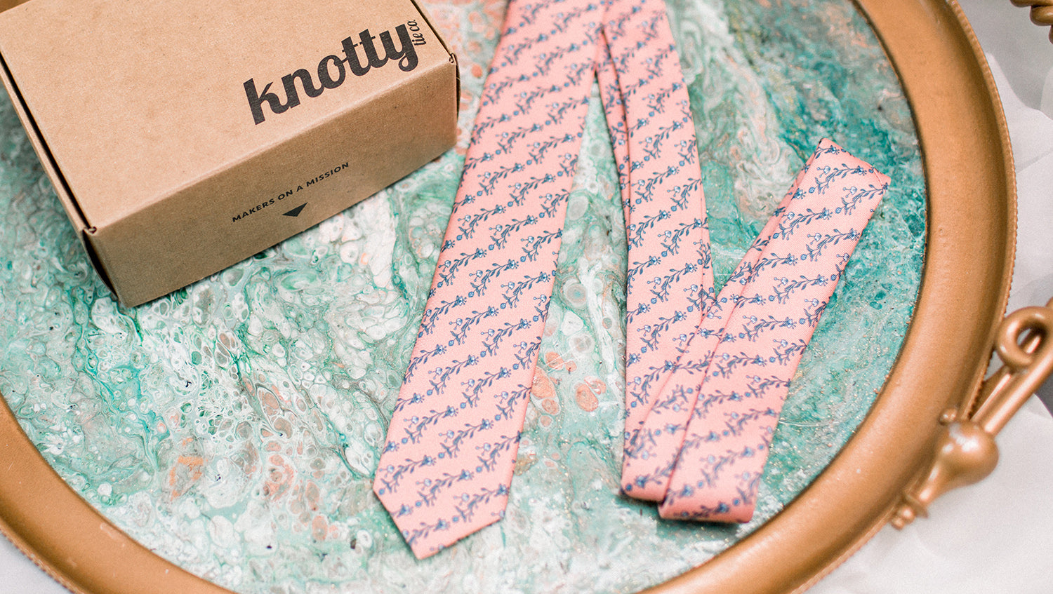 Pink floral necktie with gift box displayed