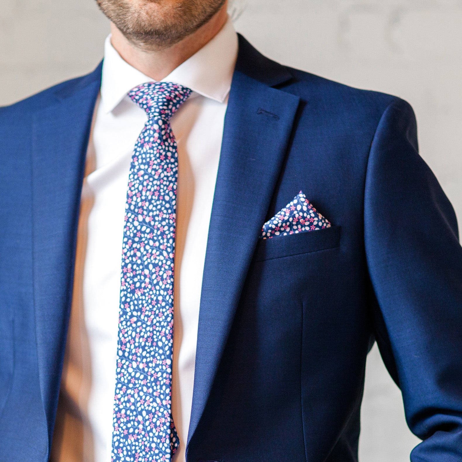 micro floral necktie and pocket square worn with suit