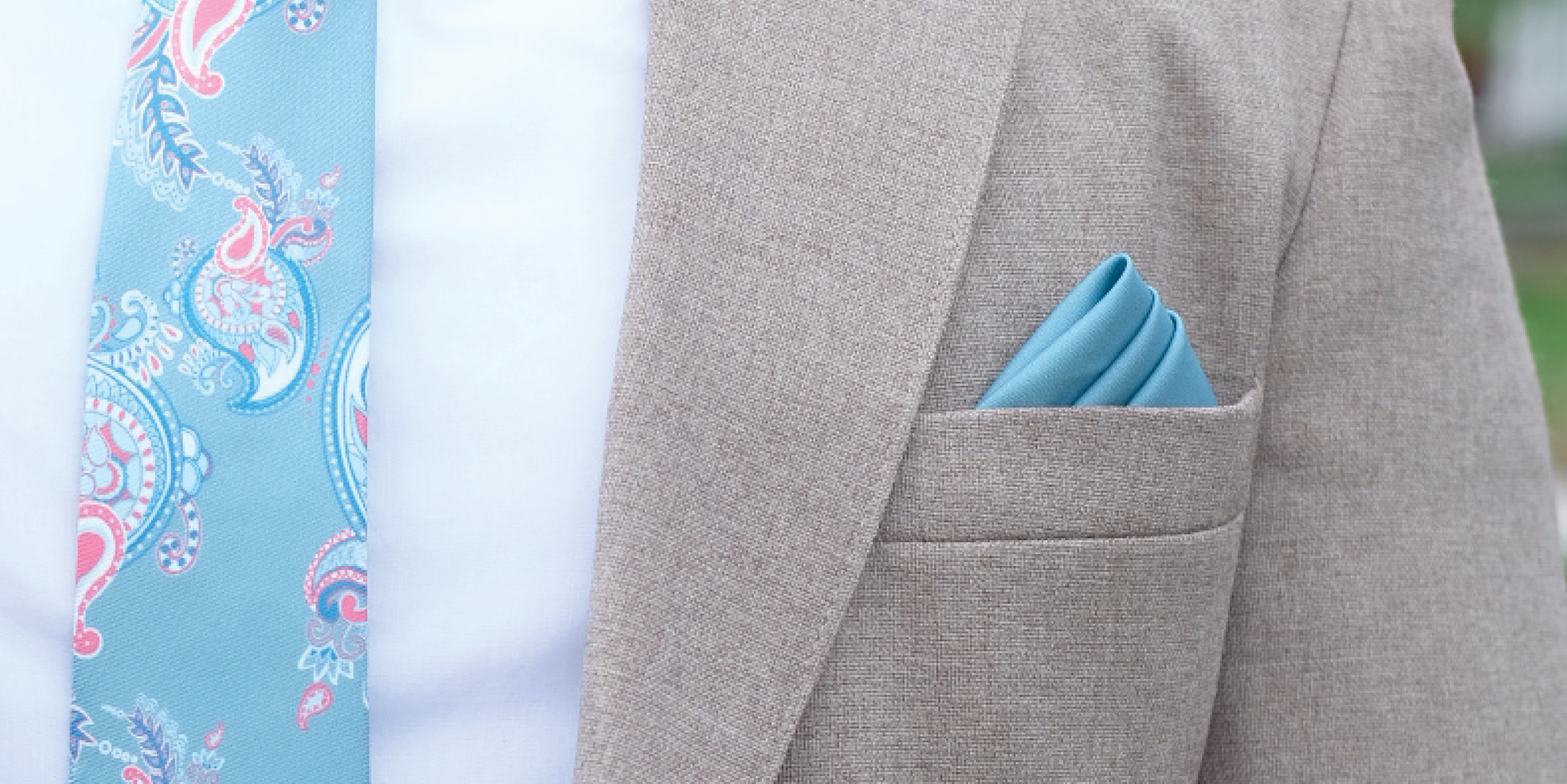 blue and pink paisley tie with solid blue pocket square