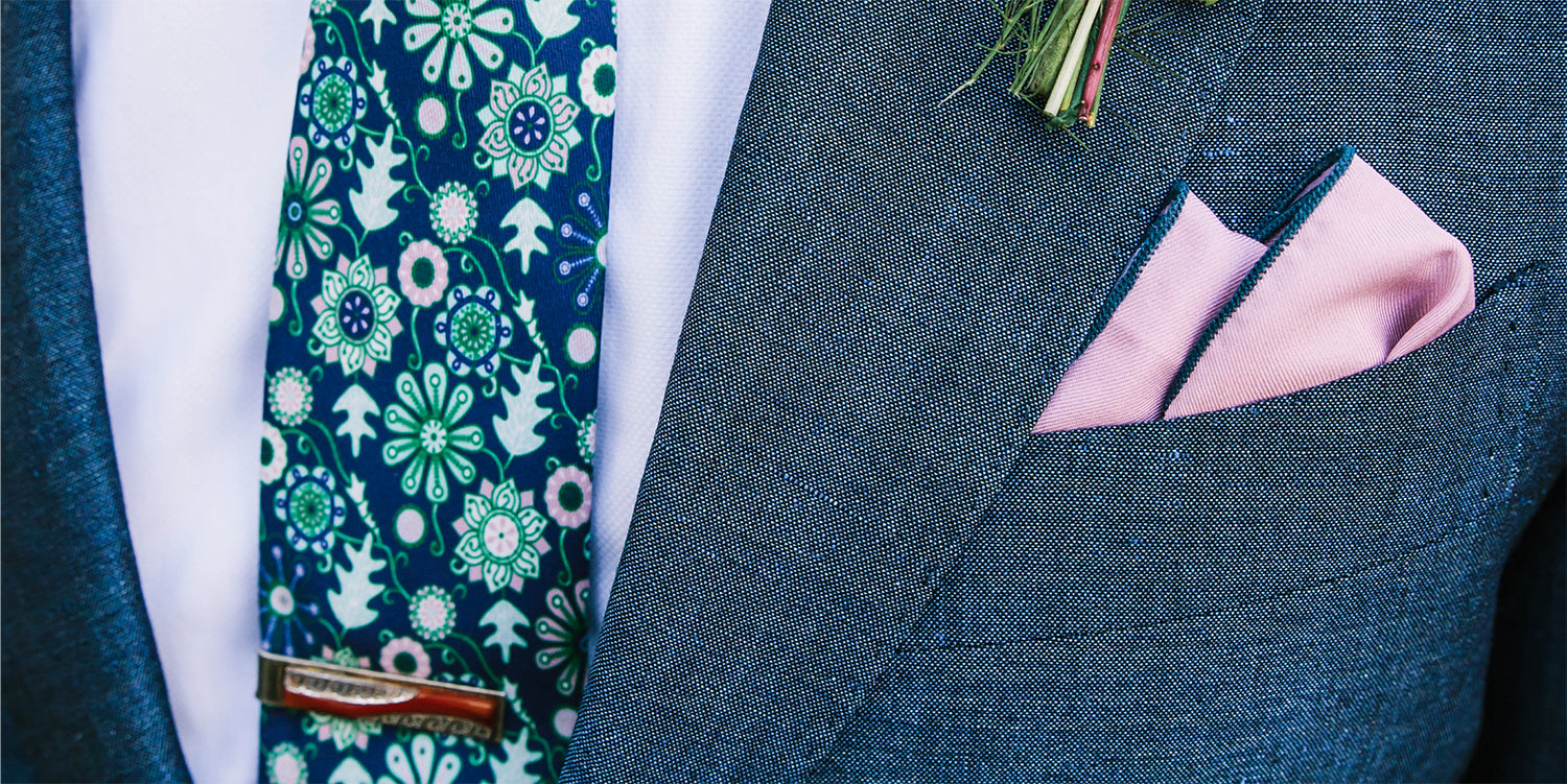 floral necktie and solid colored pocket square