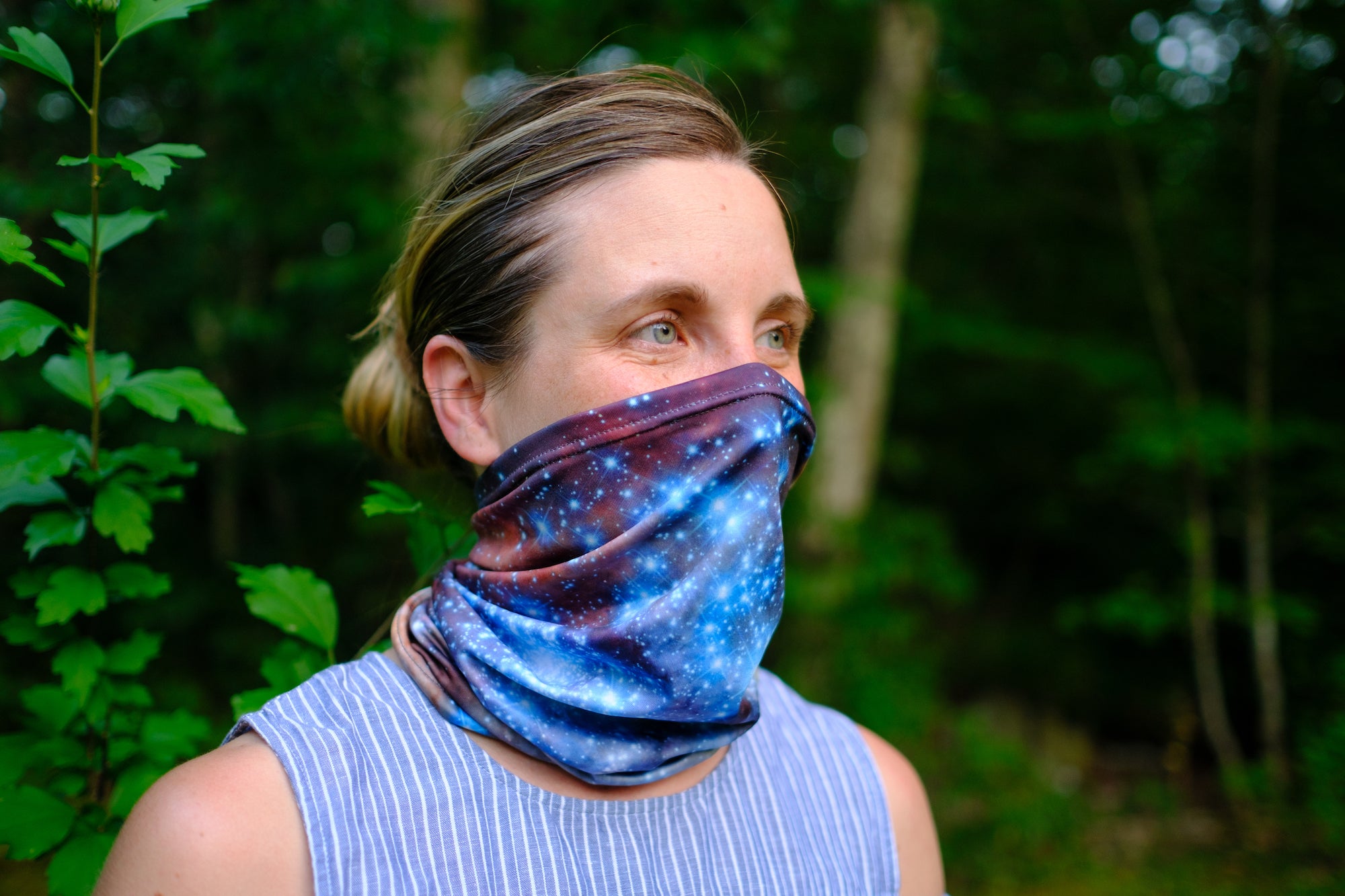 Galaxy image on neck gaiter pulled over face on a hike