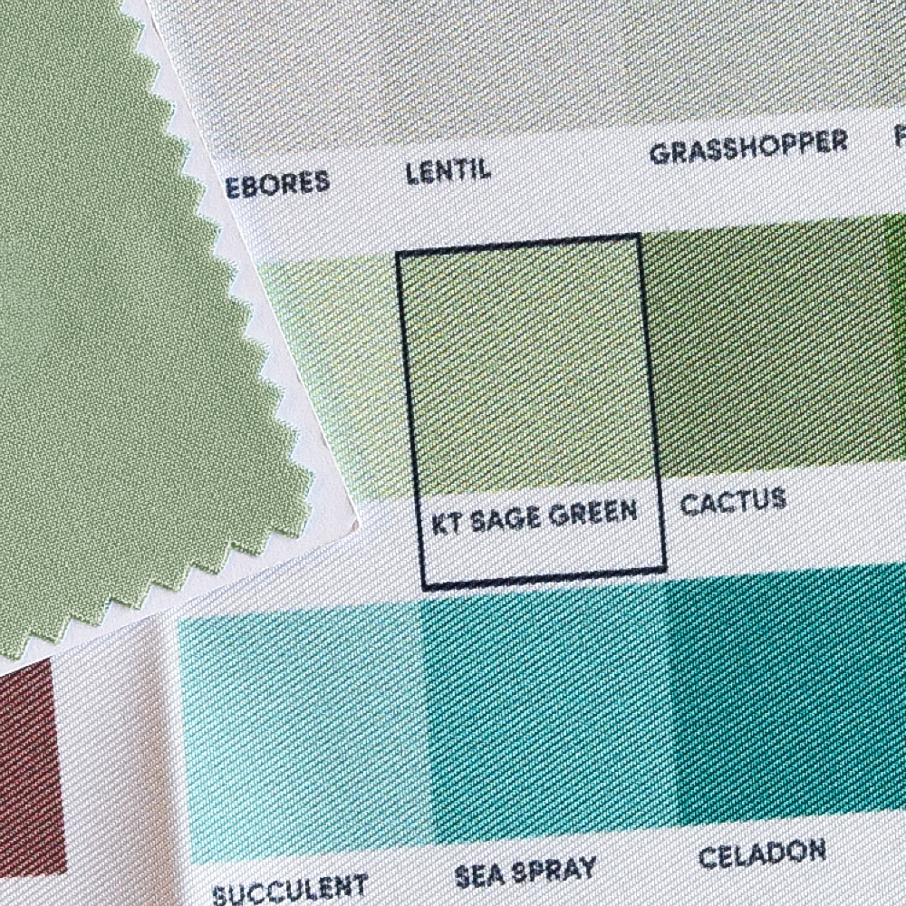 A fabric color swatch being compared to the ColorMatch Chart's labeled color names.