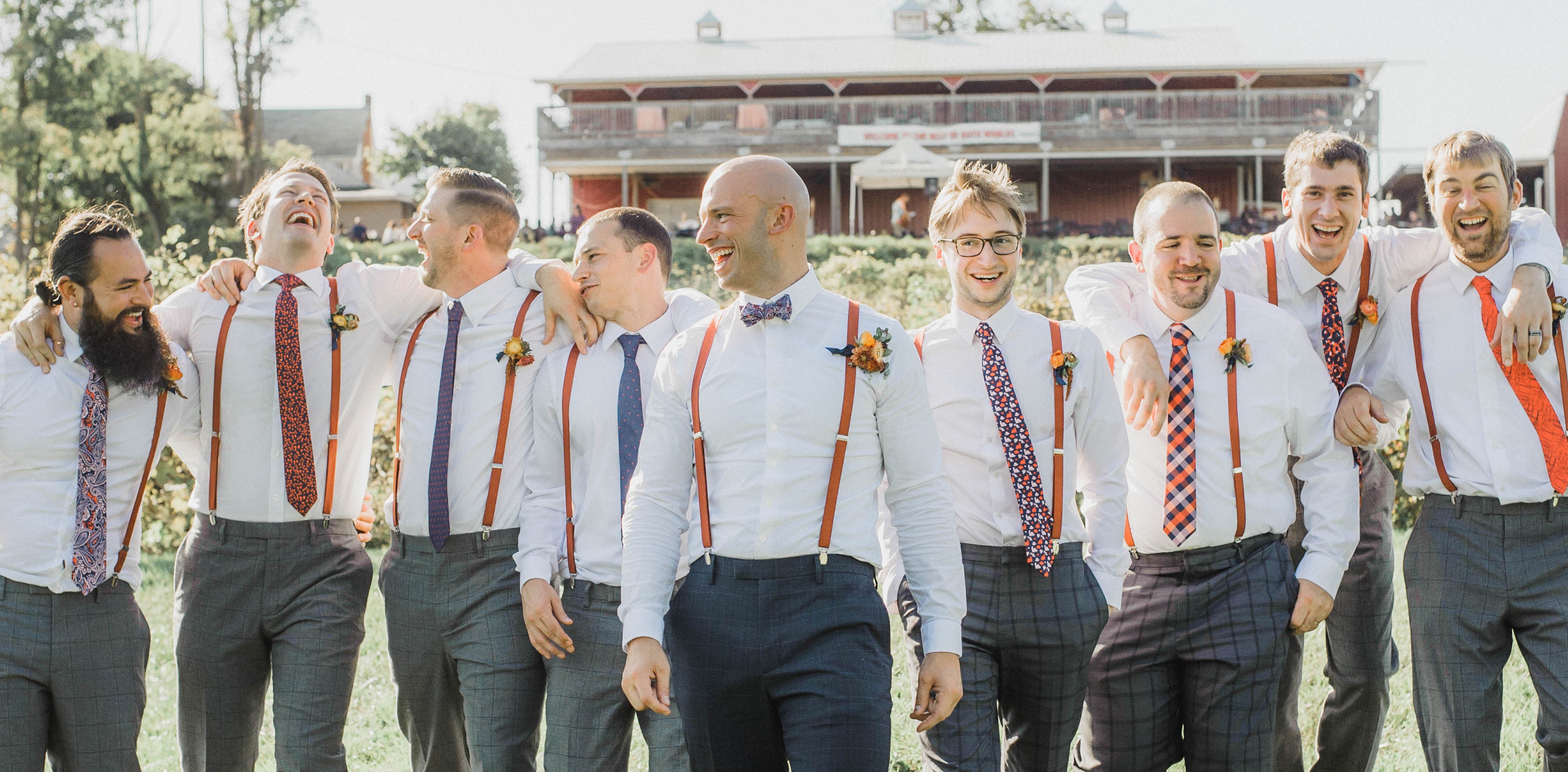 Group of groomsmen and groom with coordinating outfits
