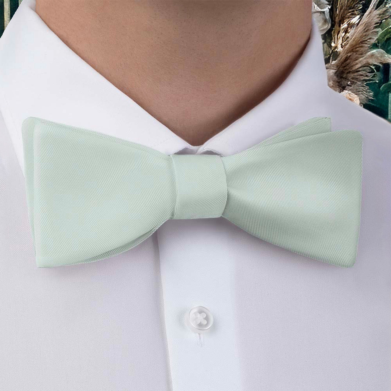 Light green bow tie matched to Azazie dresses worn with a white shirt.