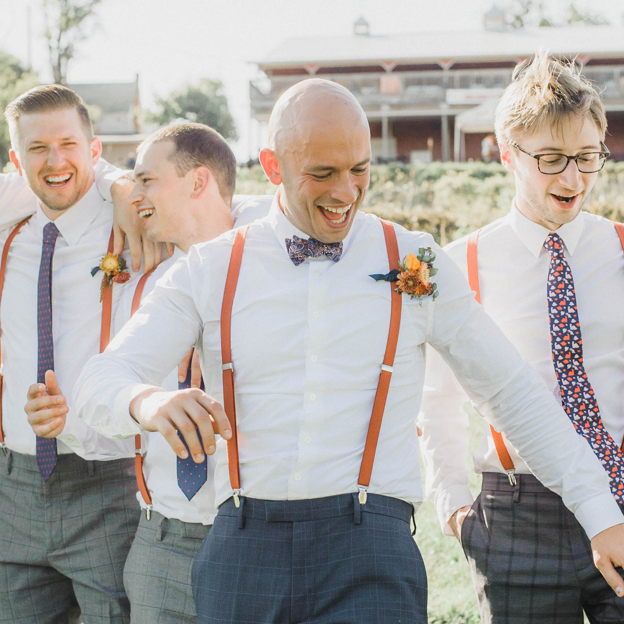 groomsmen wearing ties and bow ties