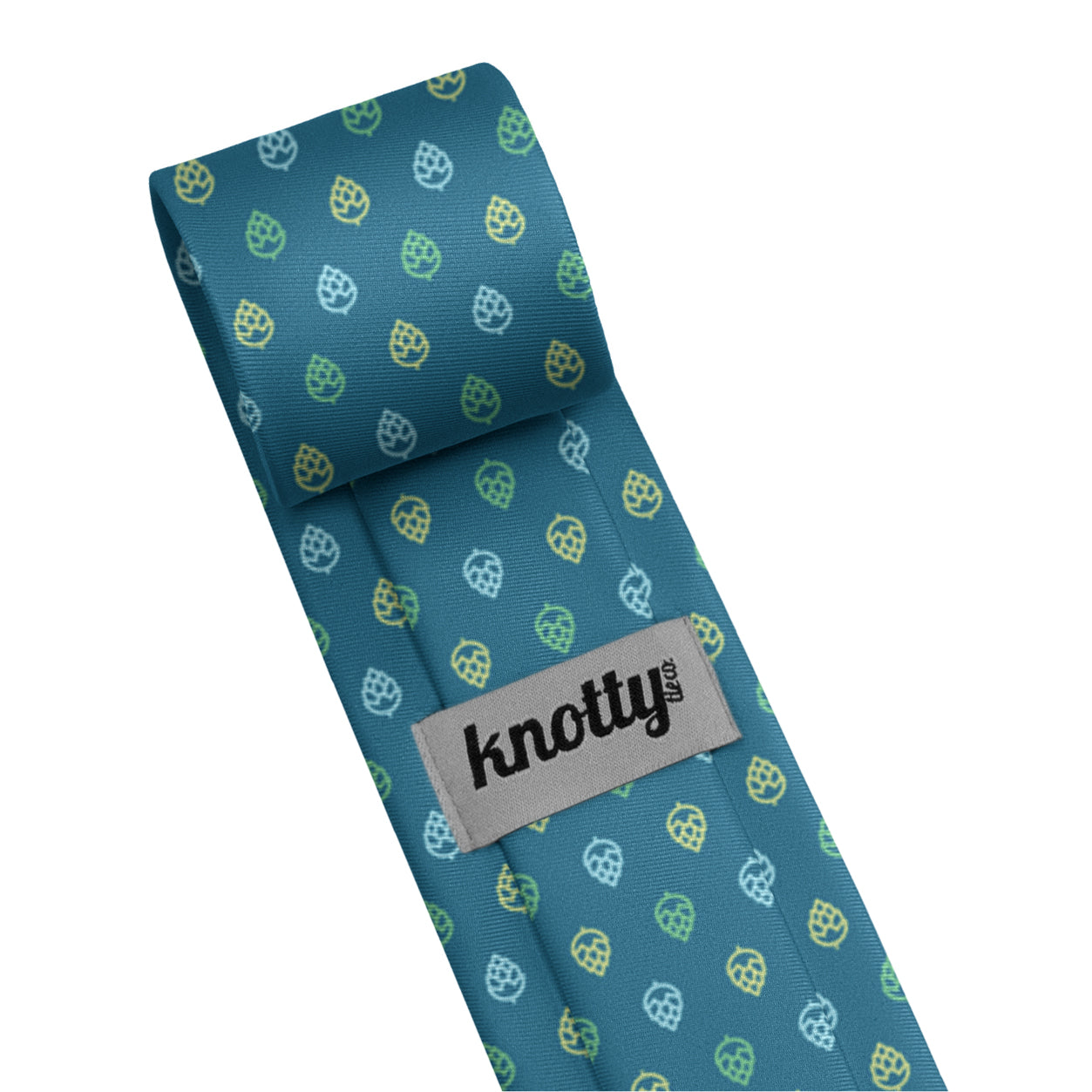 Rolled necktie back side showing tag which serves as the tail catch