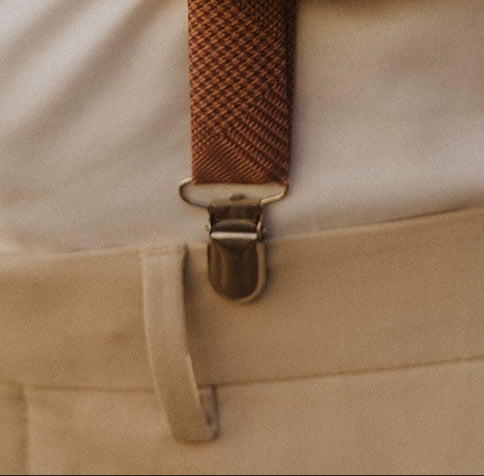 Photo of suspenders clamped to waistband with no belt