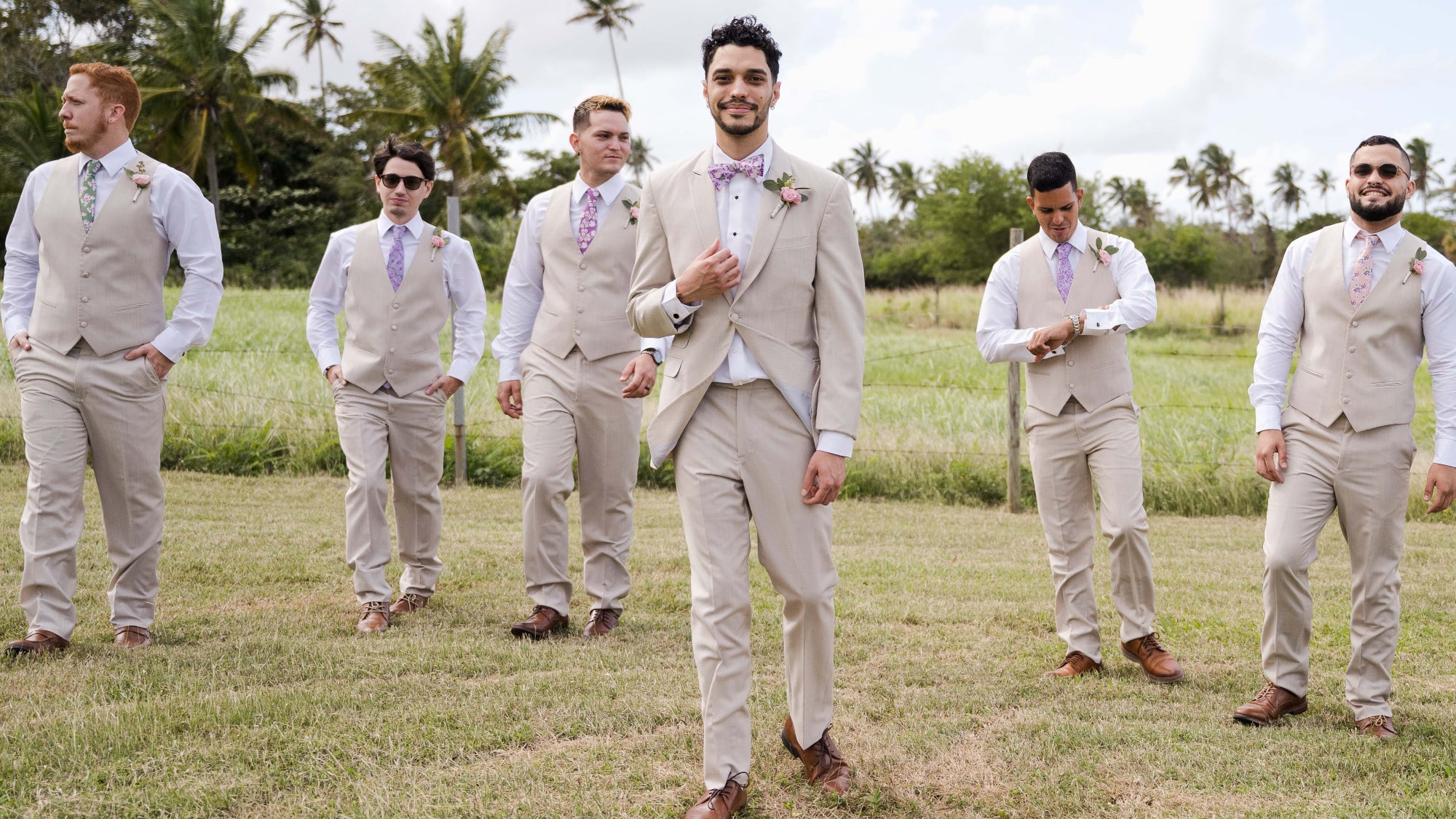 Floral ties and bow ties for wedding party paired with vests