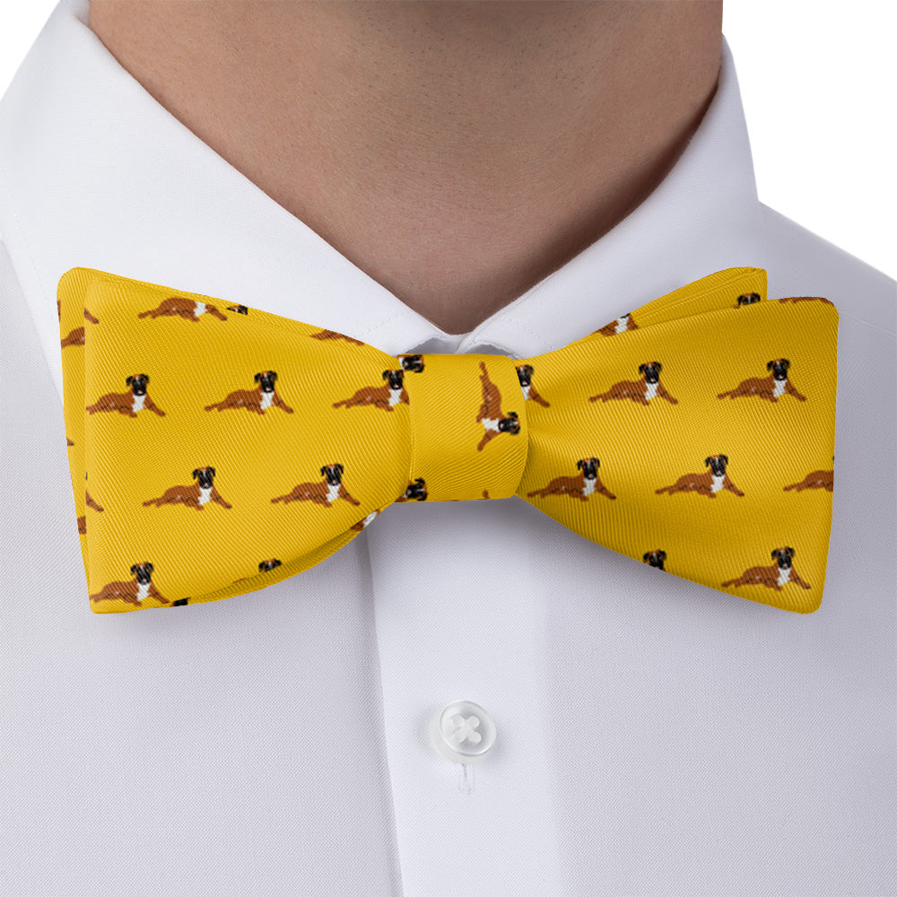 man wearing a yellow boxer bow tie