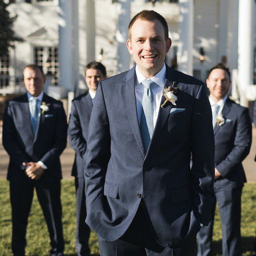 groom and groomsmen wearing ties on wedding day
