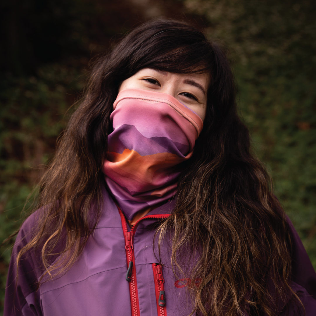 woman wearing a colorful neck gaiter