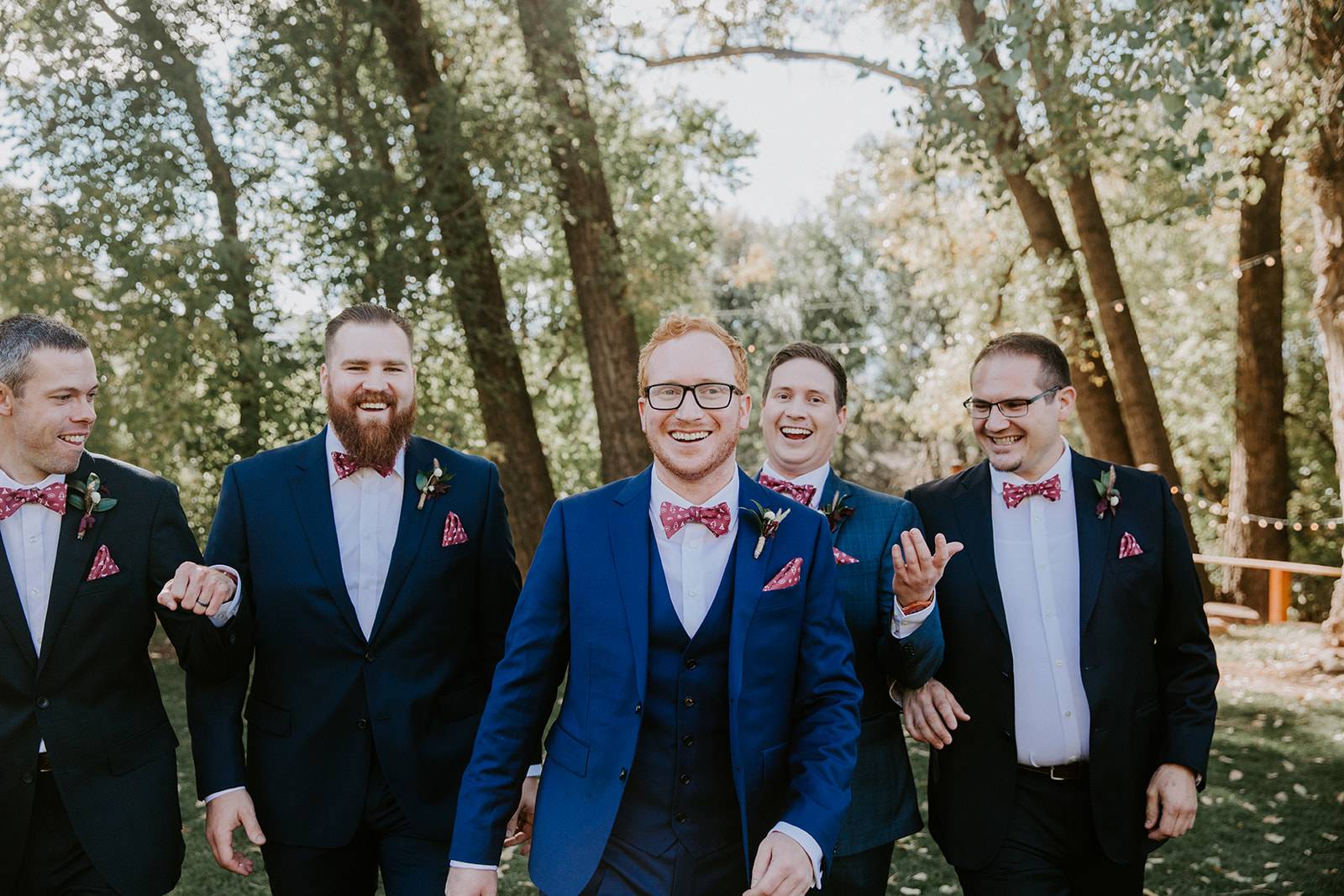 Bridal Party wearing custom red bow ties and pocket squares
