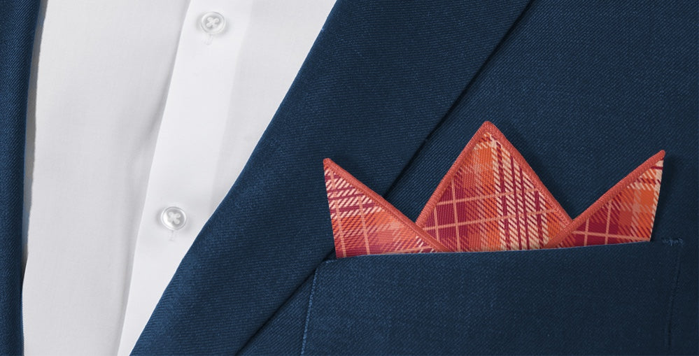 Plaid pocket square folded in suit jacket pocket