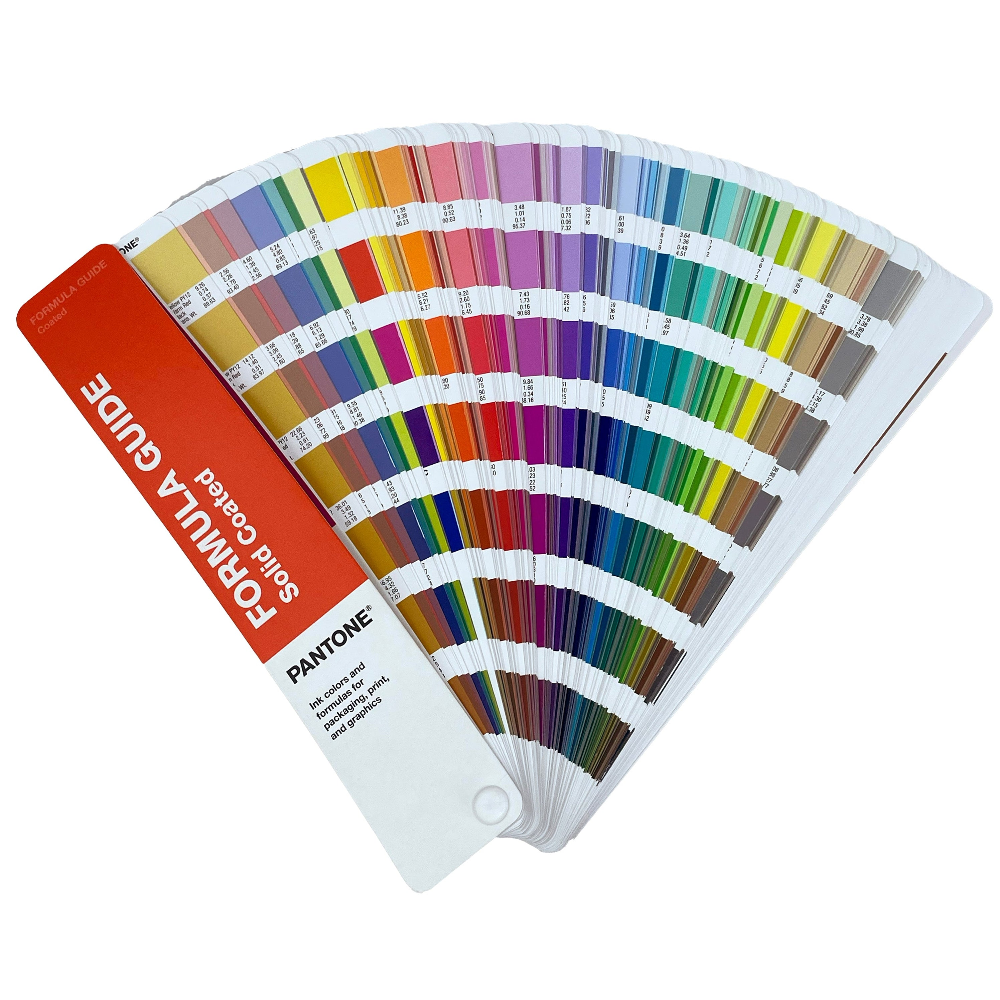 Pantone color guide open to display a range of colors on a white background