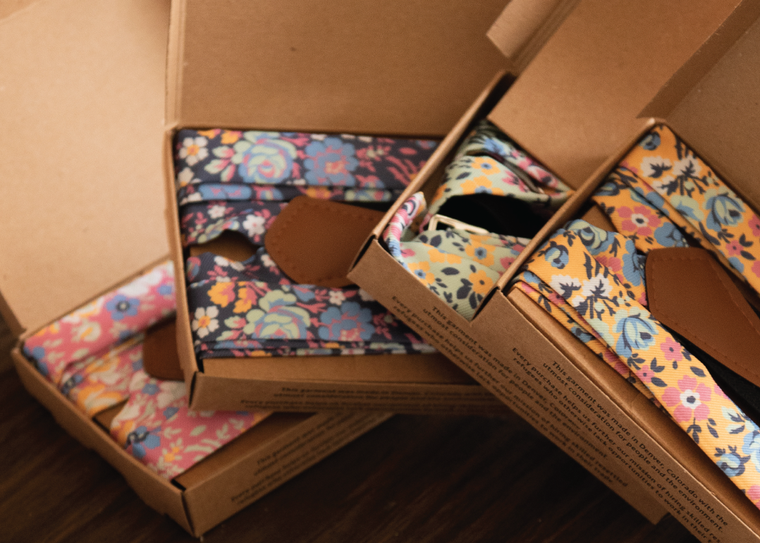 Four customized floral suspenders in gift packaging