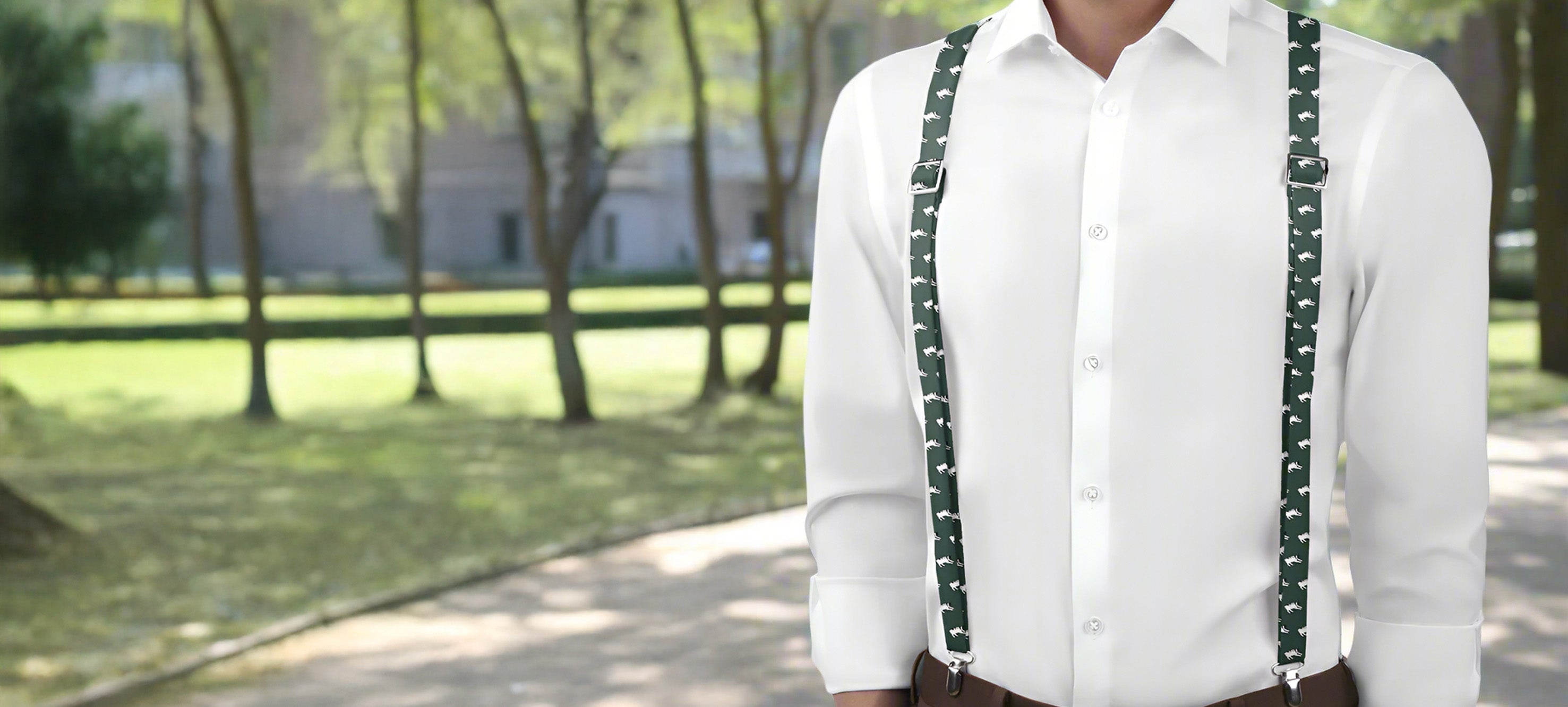 Person wearing a white shirt with green dog themed suspenders- Knotty Tie Co