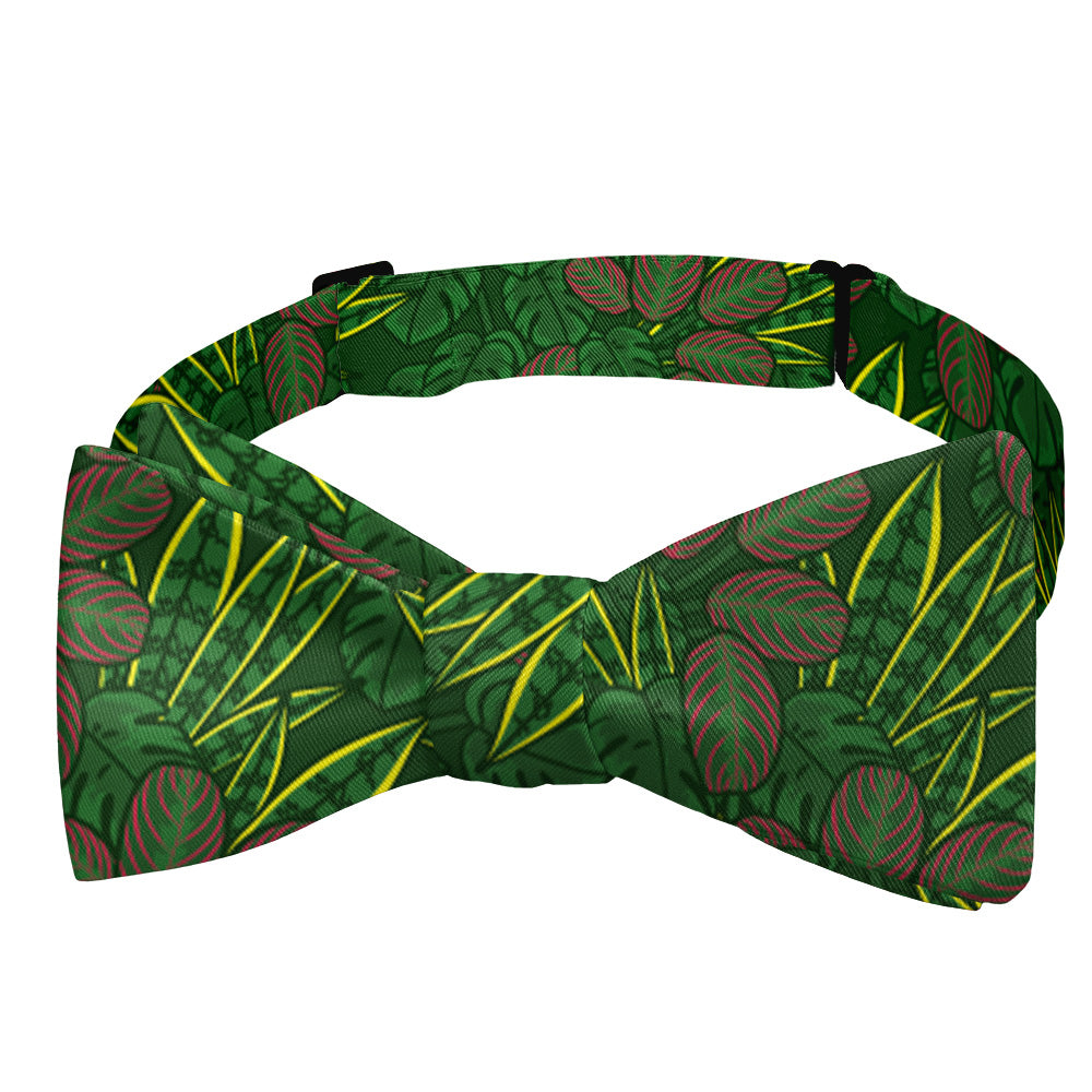 Green bow tie with leaf pattern on a white background