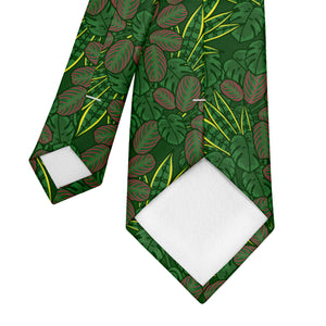 Green leaf-patterned pocket square in a brown suit pocket