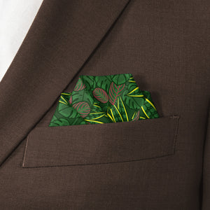 Green houseplant leaf-patterned pocket square in a brown suit pocket