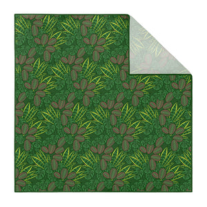 Patterned houseplant pocket square with green leaves and brown shapes on a white background