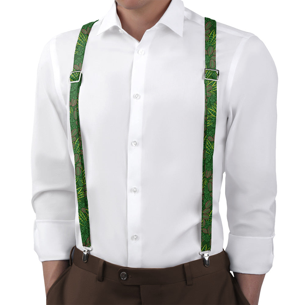 White shirt with green suspenders and brown pants on a white background
