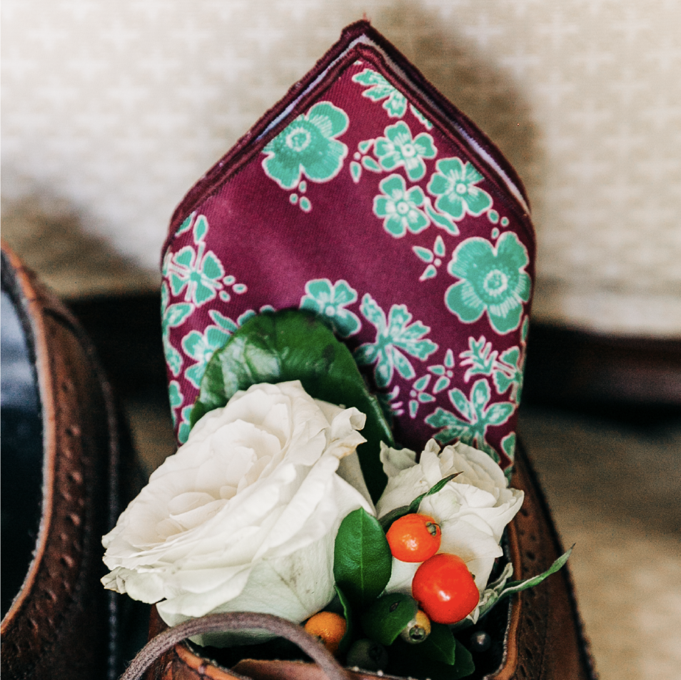Floral pocket square with boutonniere