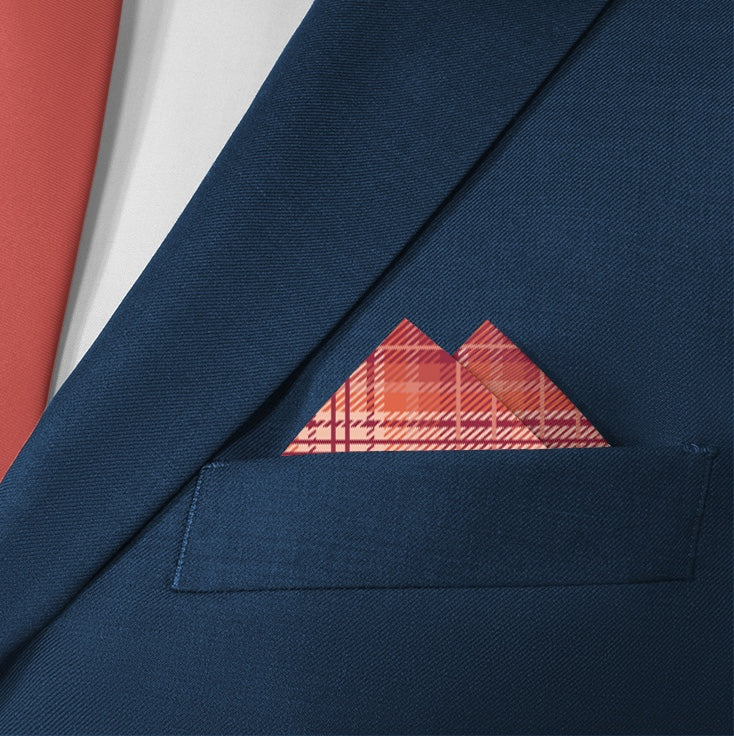 Folded plaid pocket square in suit pocket