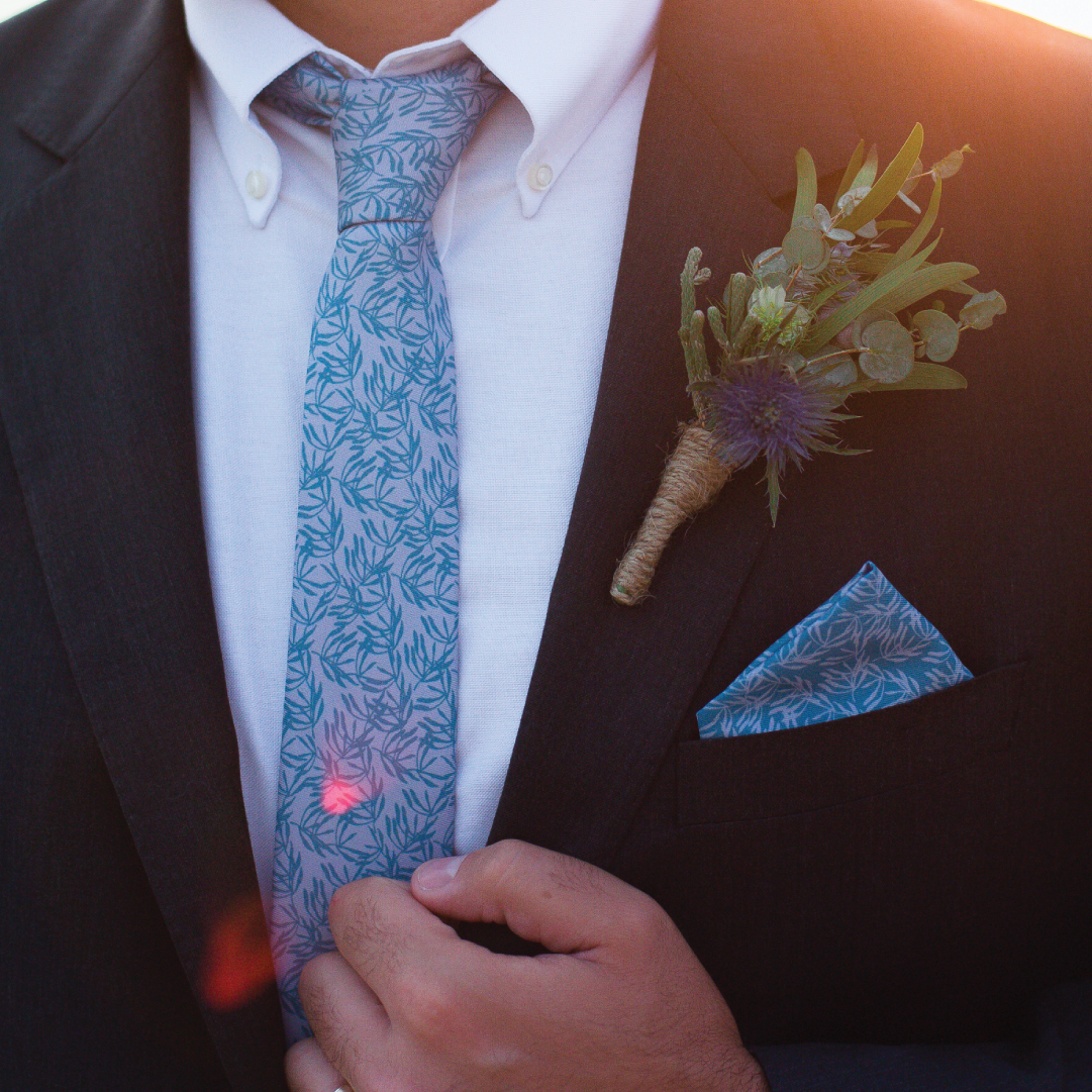 blue leafy patterned necktie and pocket square