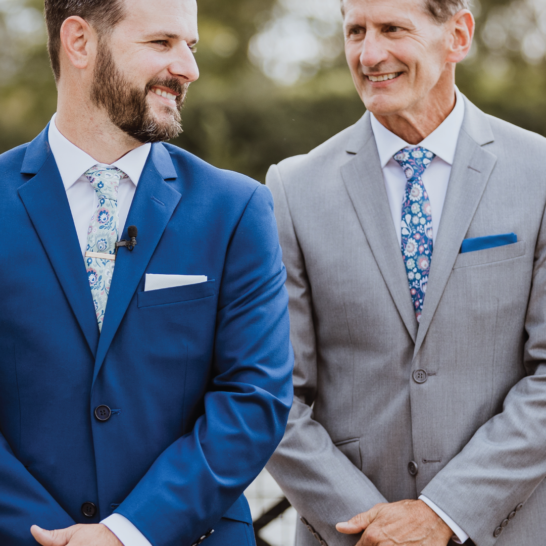 Solid pocket squares paired with floral neckties