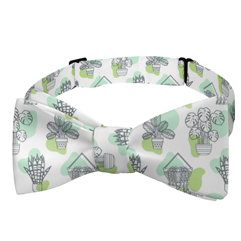 Bow tie with potted plant pattern on a white background