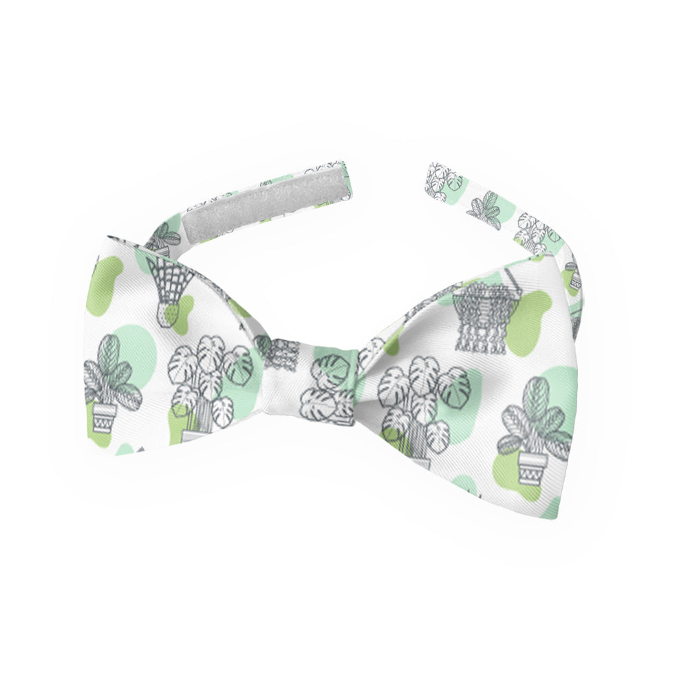 Green and white potted plant patterned kids bow tie on a white background