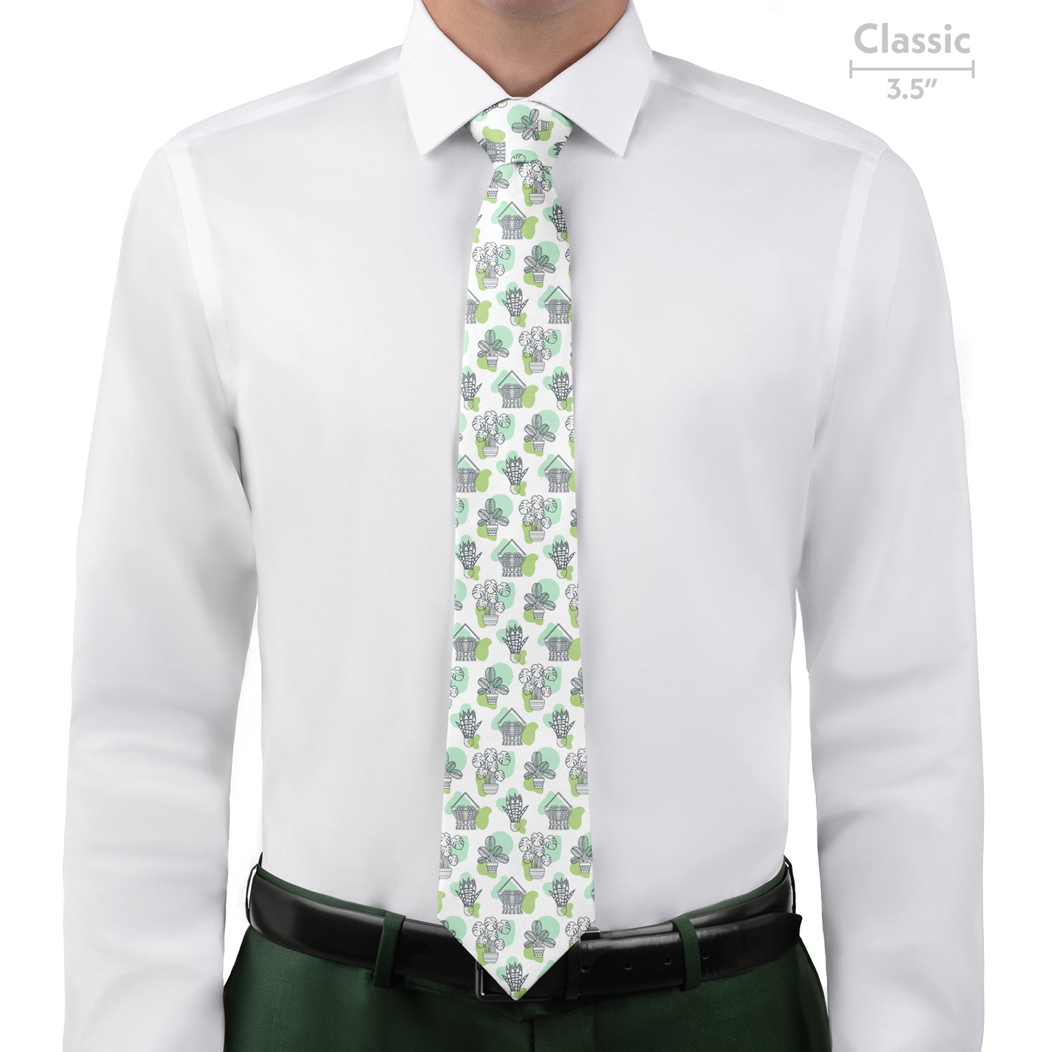 Man wearing a white shirt with a patterned potted plant green tie on a white background