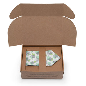 Open cardboard box with a green and white potted plant patterned tie inside on a white background