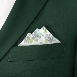 Green suit jacket with a potted plant patterned pocket square featuring plants.