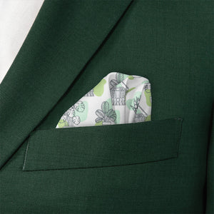 Green suit jacket with a patterned pocket square featuring potted plants.