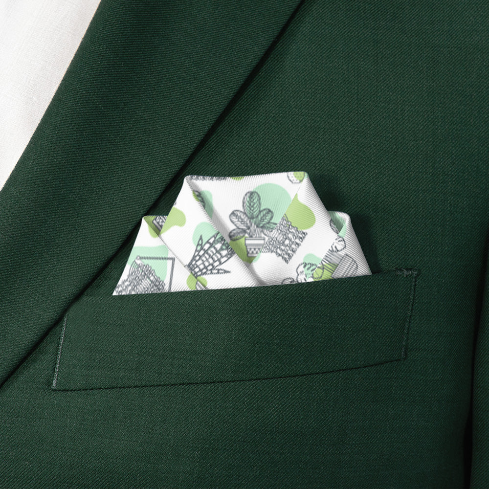 Green suit jacket with a potted plant patterned pocket square.