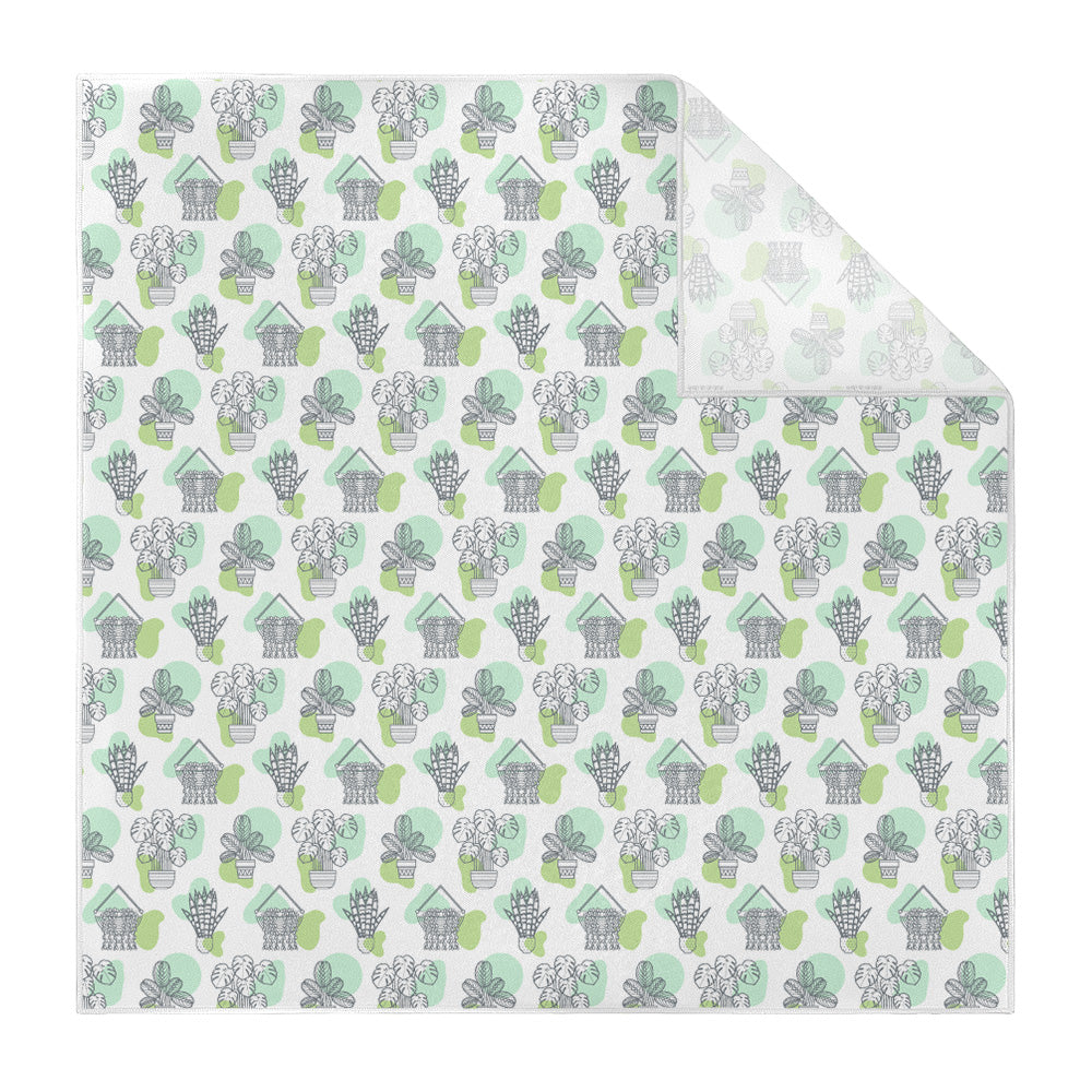 Patterned pocket square with green and gray house plant design on a white background