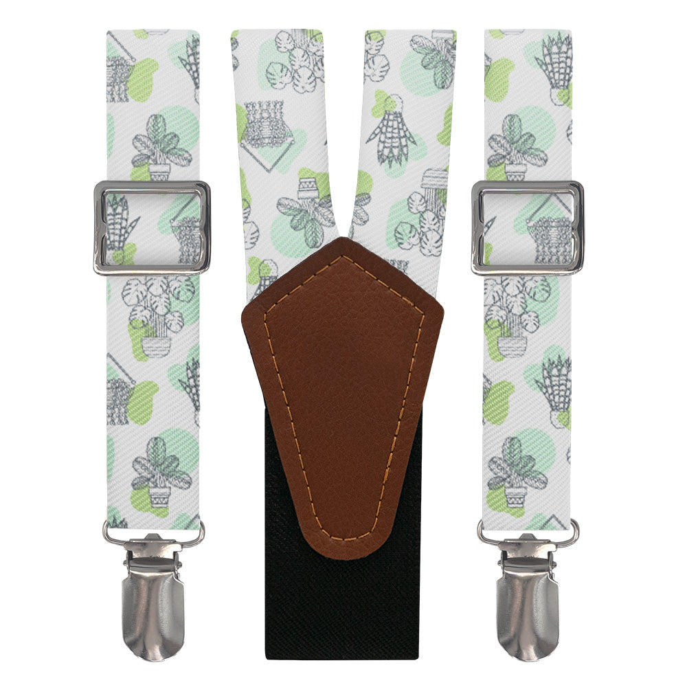 Suspenders with potted plant pattern and brown leather y-back on a white background
