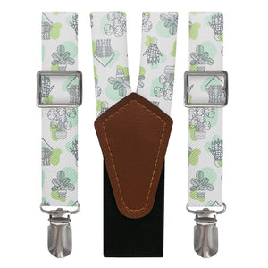 Suspenders with potted plant pattern and brown leather y-back on a white background