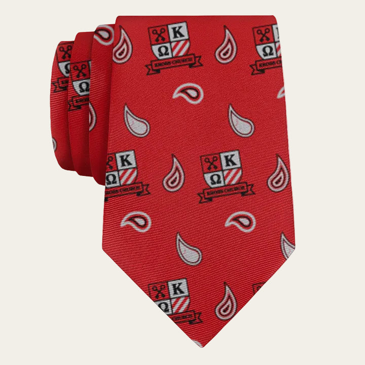 Red tie with logos and patterns on a white background
