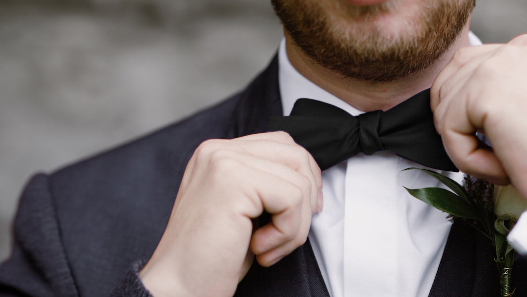 man wearing a black bow tie