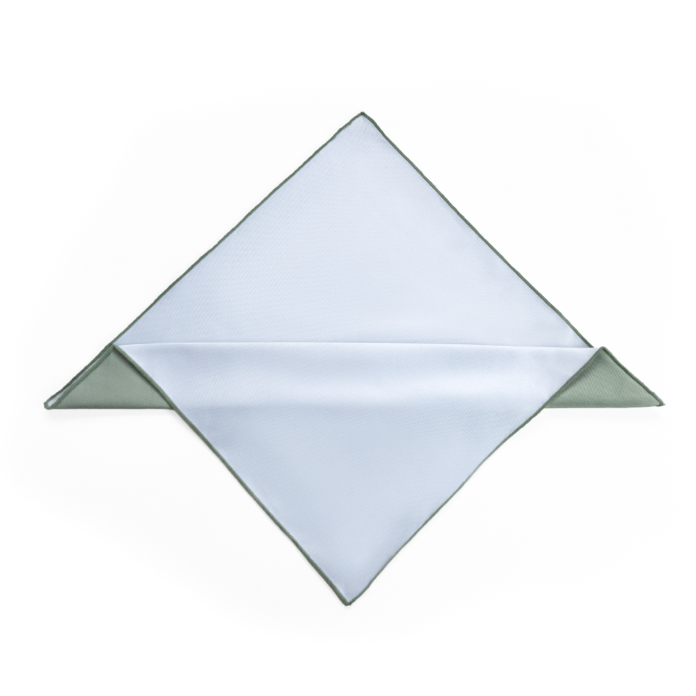 A folded pocket square or handkerchief, displayed in a diamond orientation with sage green edges visible.