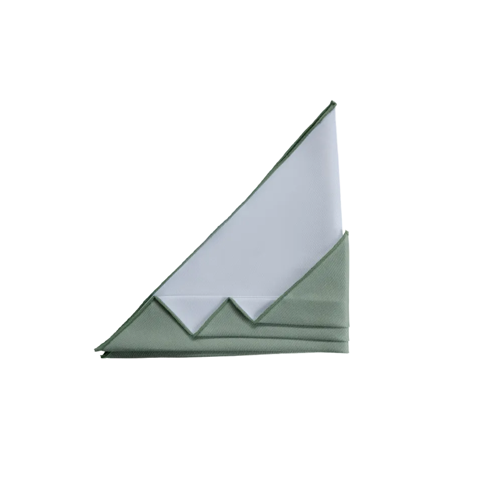 A folded green pocket square with a white inner layer, arranged in a mountain-like triangular fold.