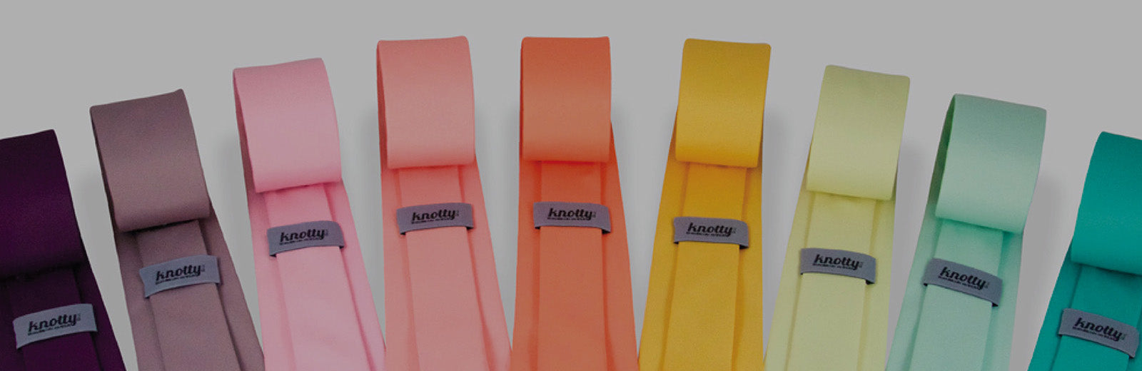 neckties in a rainbow of colors