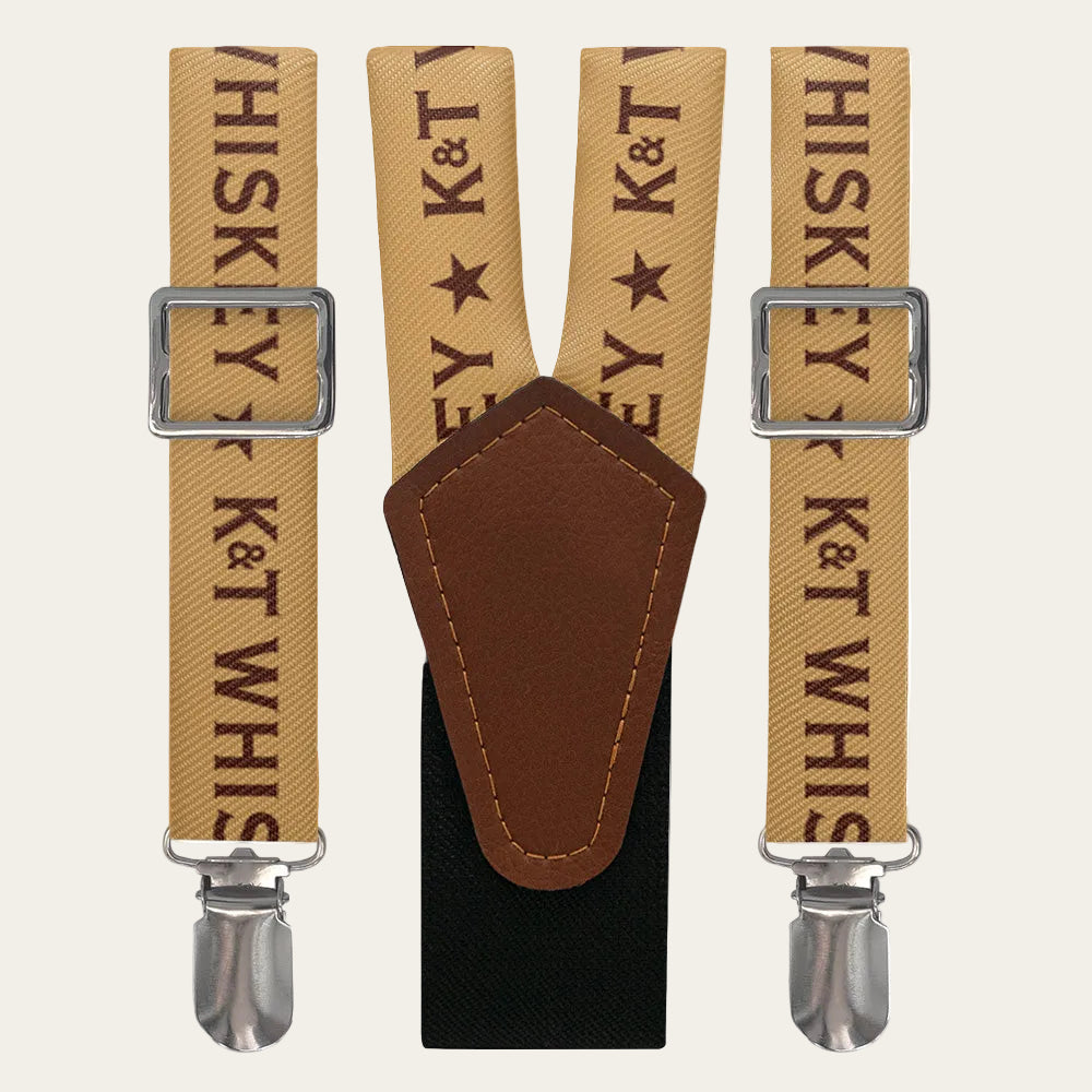 Suspenders with 'K&T Whiskey' text and leather patch on a white background