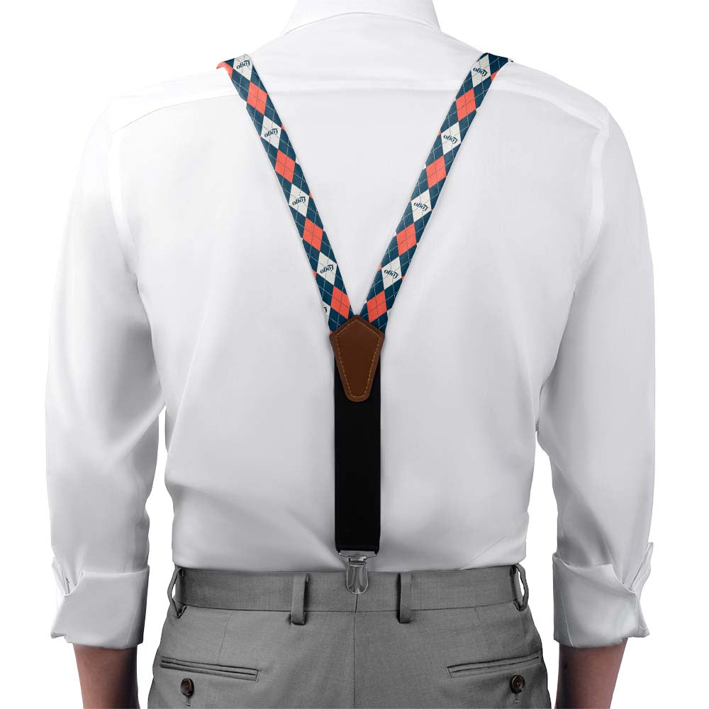 Person wearing a white shirt with colorful logo suspenders and gray pants on a white background