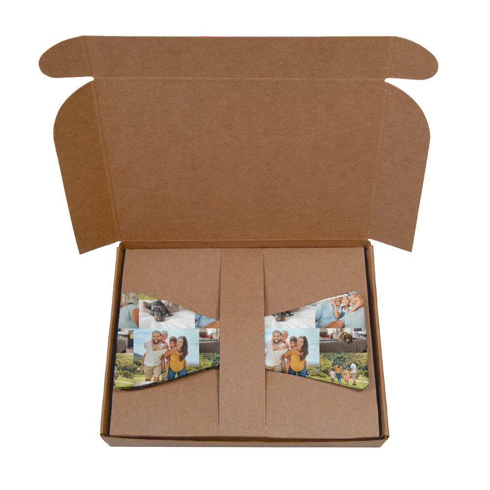 Open brown kraft box with a bow tie featuring printed images of people and pets.