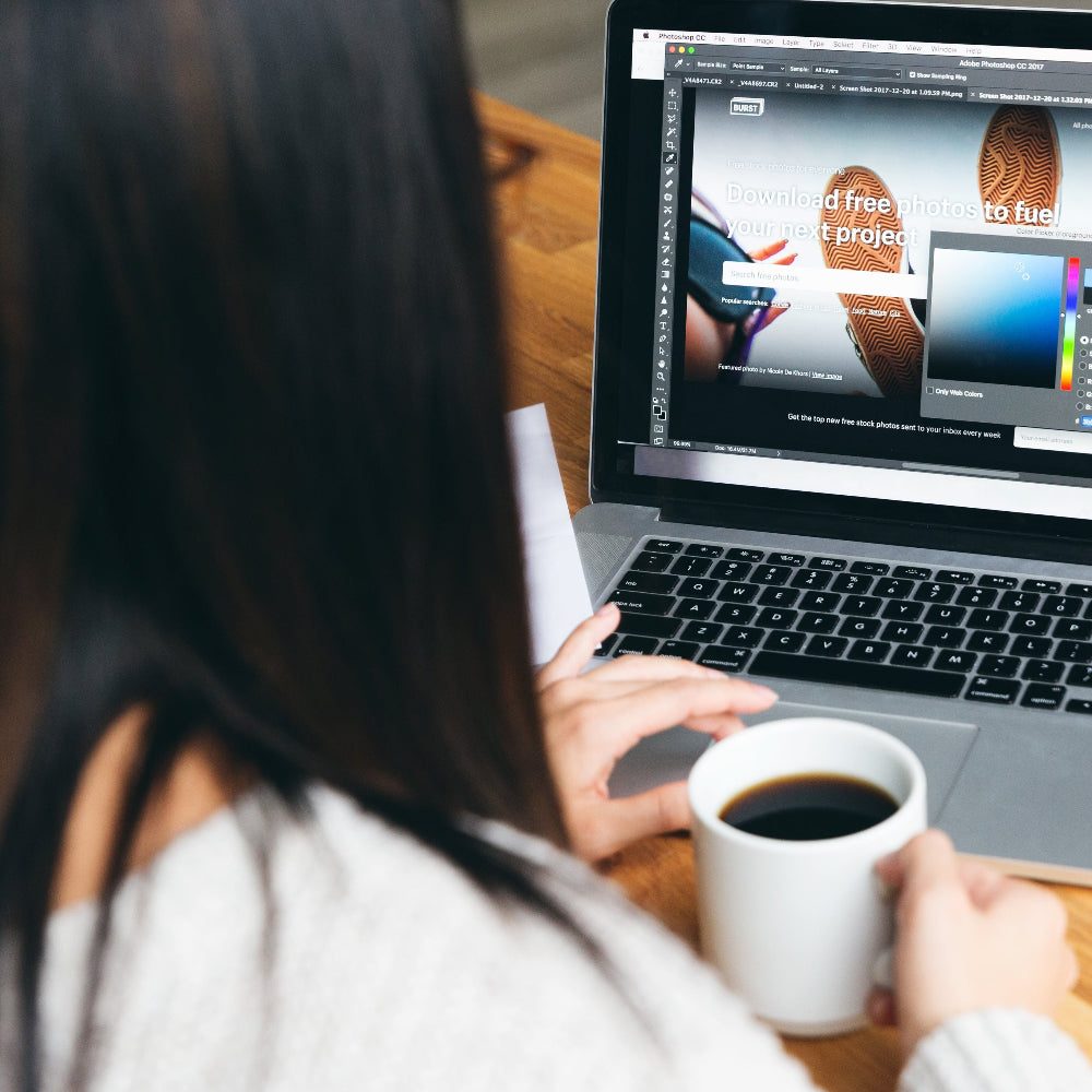 person selecting colors using a laptop scroll pad