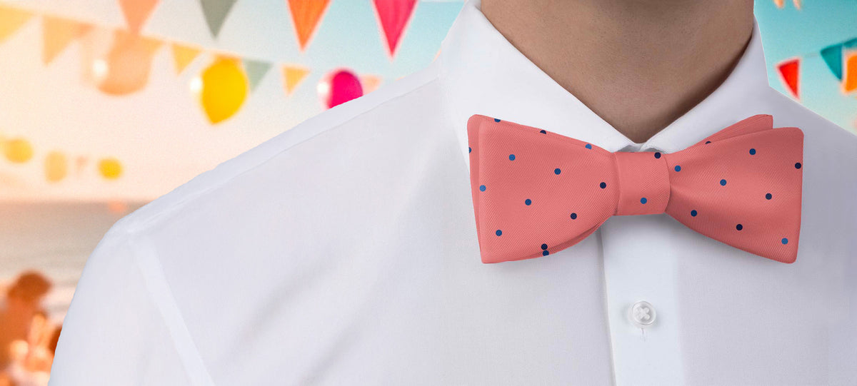 Person wearing a pink polka dot bow tie at a colorful party