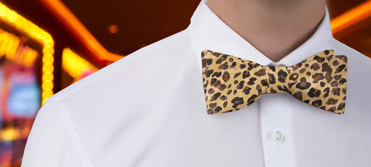 Cheetah print bow tie worn by a person with a blurred background